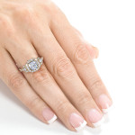 Shimmering Yaffie Gold 1.875ct Moissanite and Diamond 3-Stone Halo Engagement Ring.