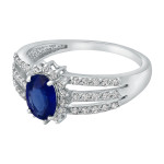 Gorgeous Vivid Blue Oval Sapphire and Diamond Halo Engagement Ring in White Gold by Yaffie
