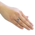 Elegant Oval Blue Sapphire and Diamond Halo Engagement Ring in Yaffie White Gold